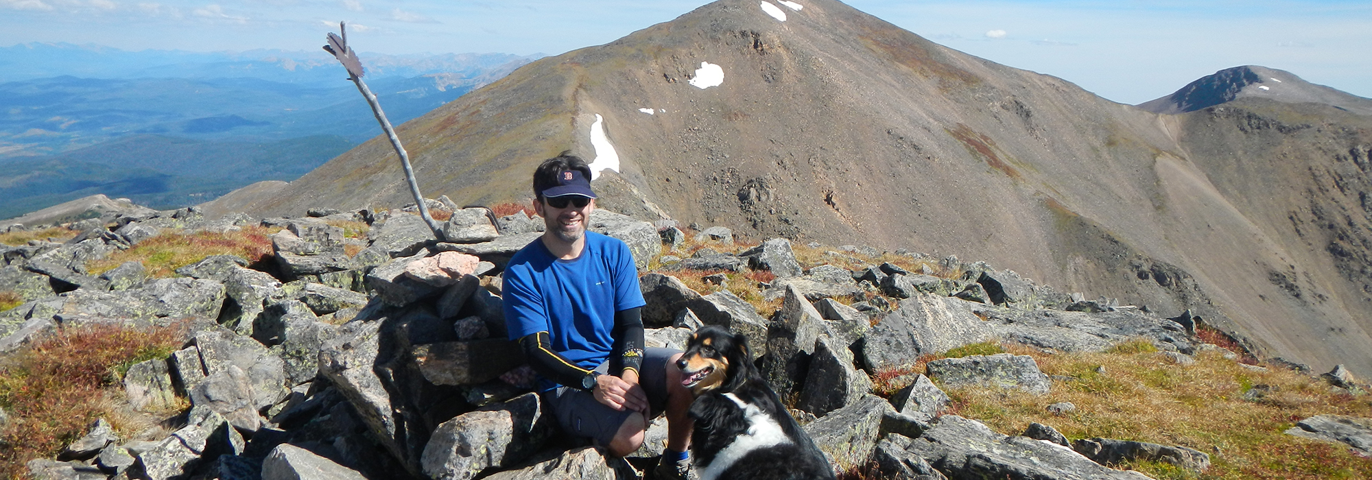 Author James Dziezynski with his dogs on Mount Eva Colorado